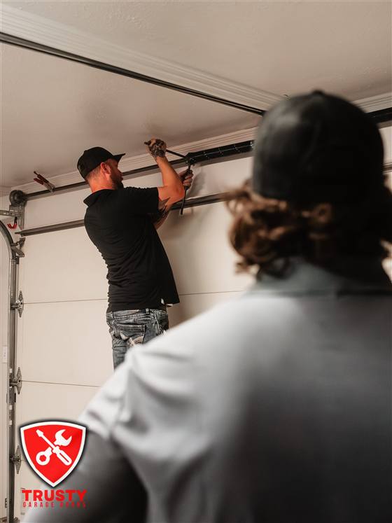 Trusty Garage Doors repair team working on a garage door in North Richland Hills, TX