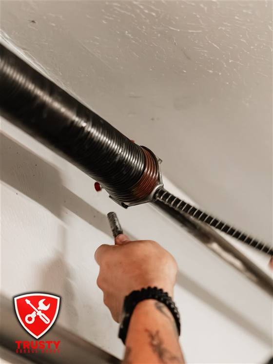 Winding a garage door torsion spring cone in North Richland Hills, TX