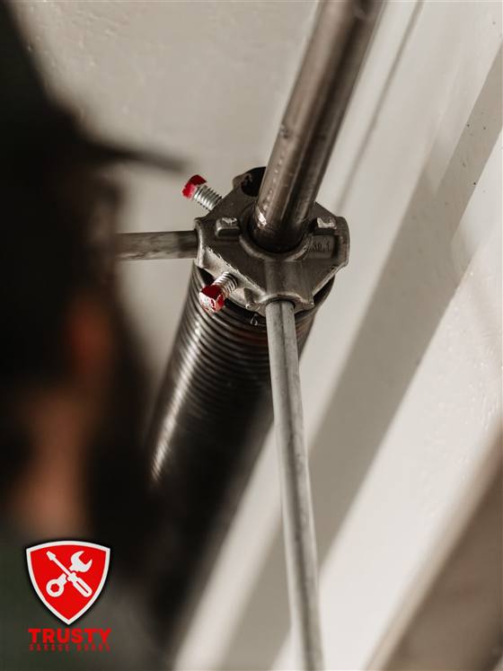 Garage door torsion spring winding cone and set screws during a repair in North Richland Hills, TX